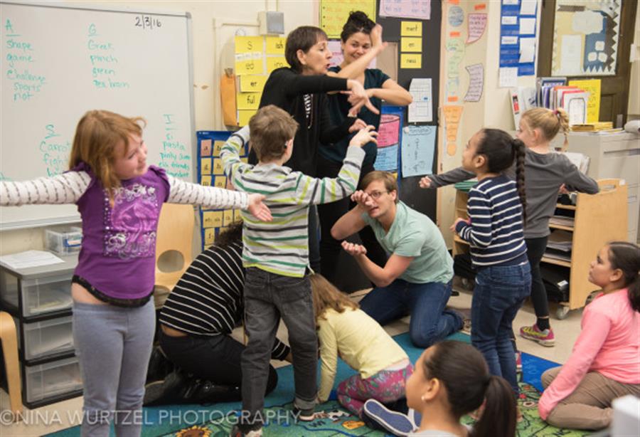 A teacher working with students.